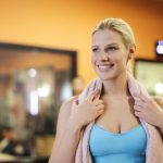 Group of women exercising indoors in a gym, reflecting healthy lifestyle and fitness.
